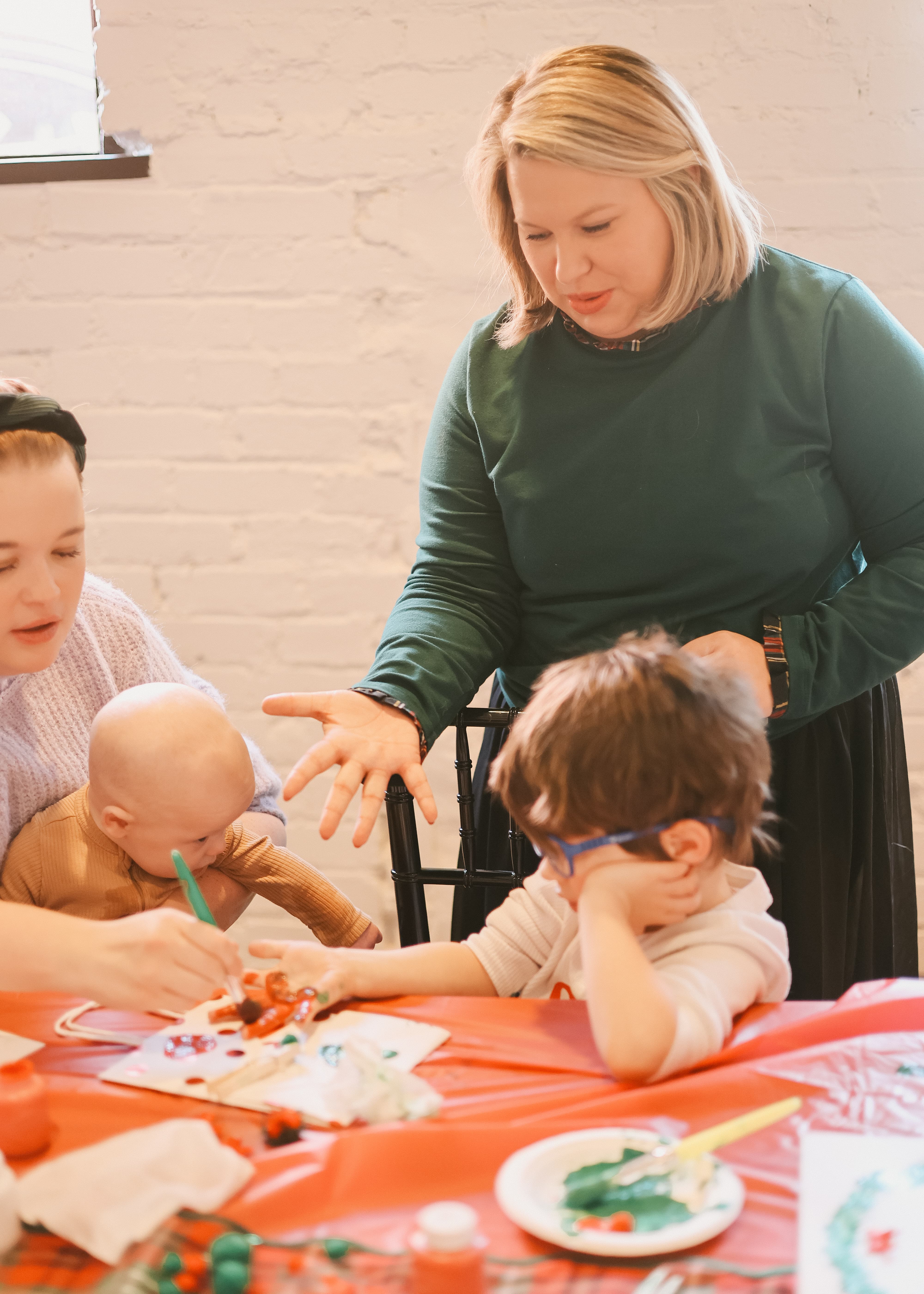 Teacher guiding children through a classroom activity